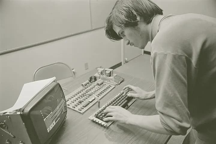 Steve Jobs working on an Apple I computer in 1976