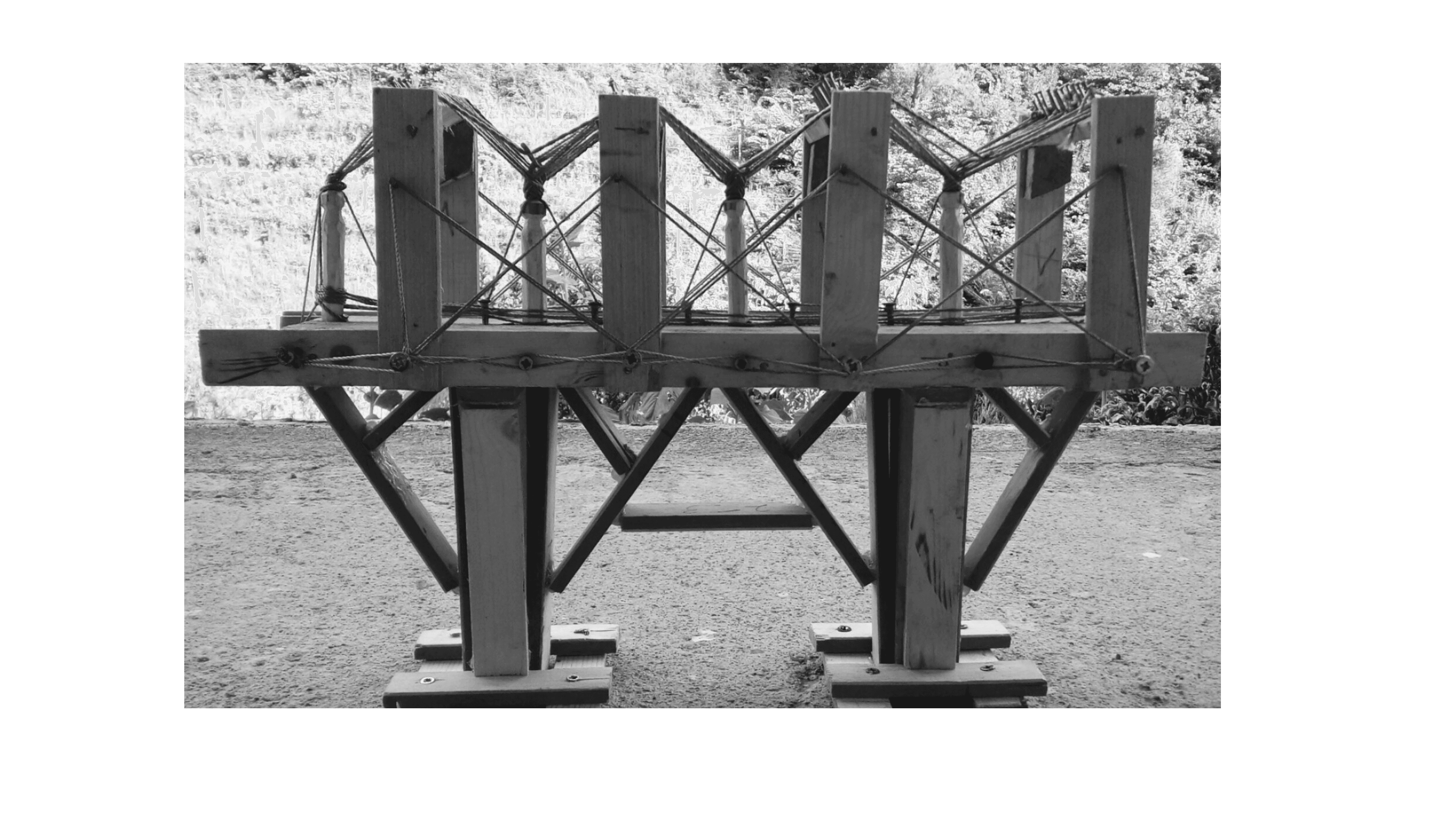 Handcrafted wooden bridge, meticulously assembled from small pieces.